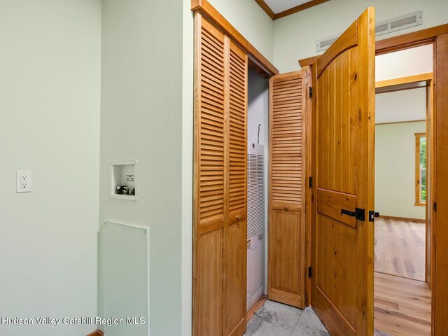 719 Allen Teator Rd, Durham, NY 12469 - corridor with a heating unit and light marble finish flooring