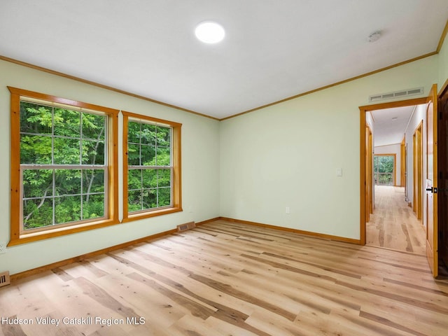 719 Allen Teator Rd, Durham, NY 12469 - unfurnished room featuring ornamental molding, light wood-style floors, and a smoke detector