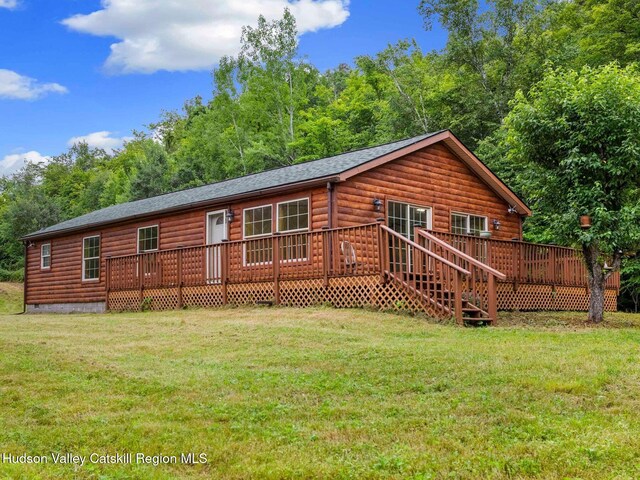 719 Allen Teator Rd, Durham, NY 12469 - back of property featuring a lawn, a deck, log veneer siding, and a shingled roof