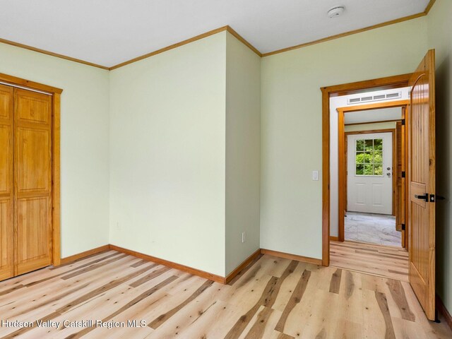 719 Allen Teator Rd, Durham, NY 12469 - unfurnished room with crown molding, a smoke detector, and light wood finished floors