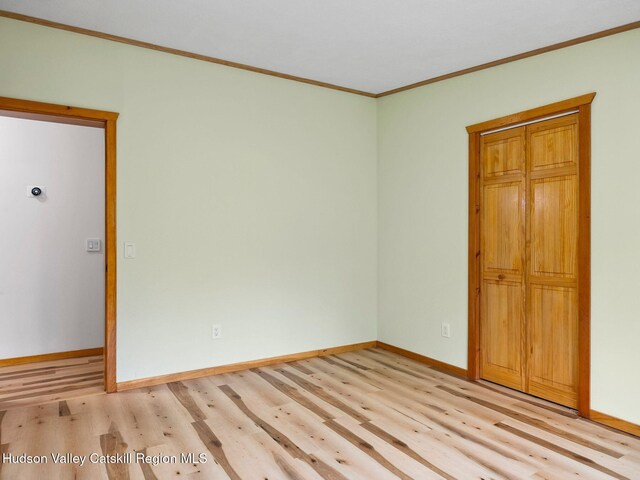 719 Allen Teator Rd, Durham, NY 12469 - unfurnished room with light wood-style flooring and crown molding