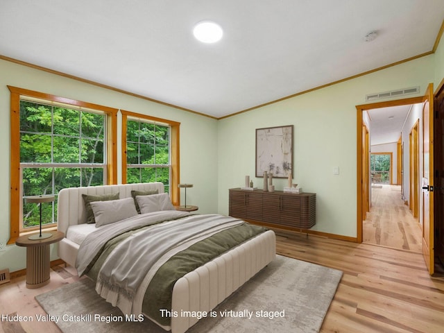 719 Allen Teator Rd, Durham, NY 12469 - bedroom featuring light wood-style floors and ornamental molding