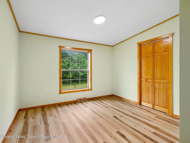 719 Allen Teator Rd, Durham, NY 12469 - empty room featuring ornamental molding and light wood-style flooring