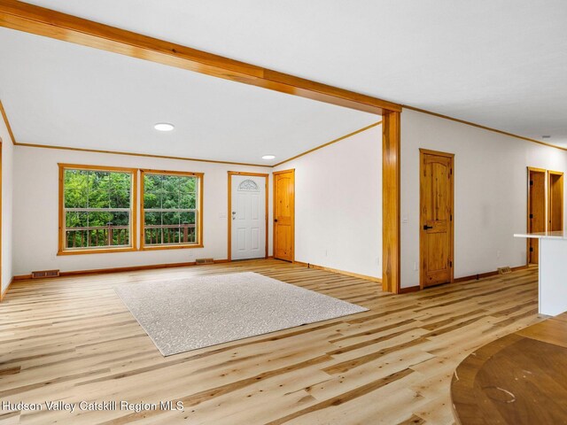719 Allen Teator Rd, Durham, NY 12469 - unfurnished living room with ornamental molding, light wood-style flooring, and recessed lighting