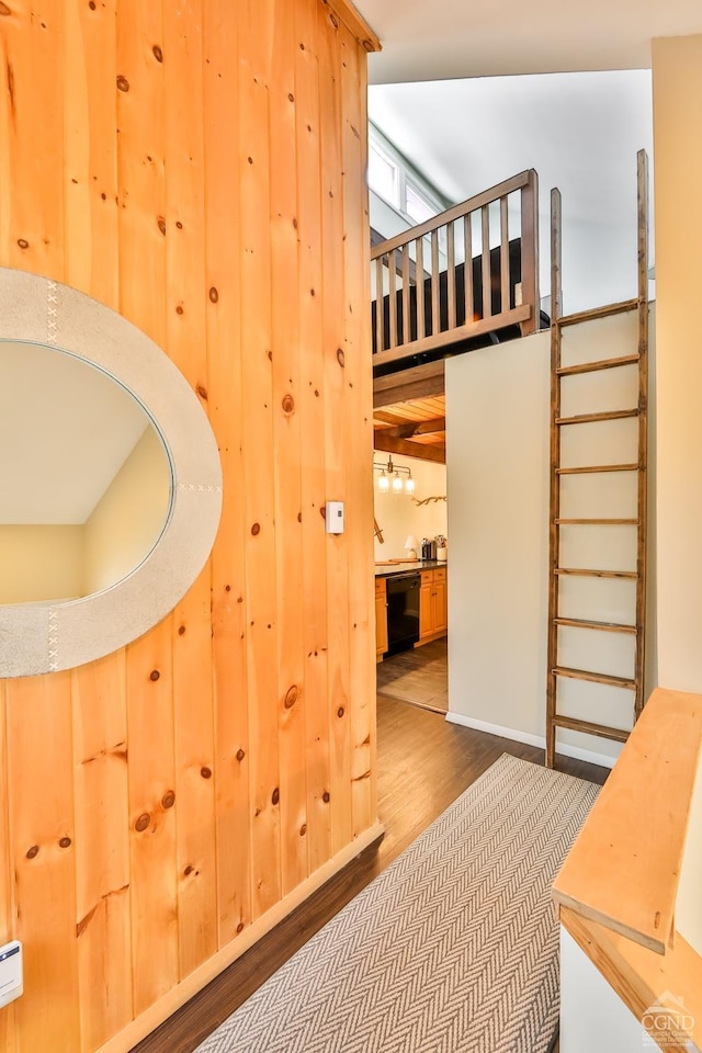 staircase with wood finished floors
