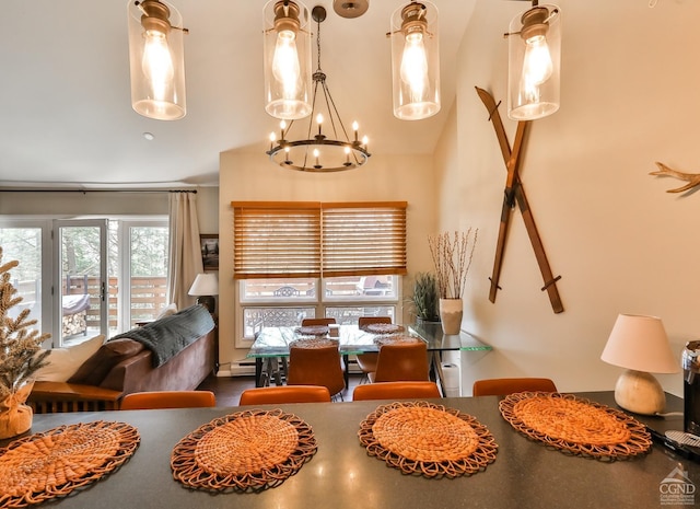 dining room with a chandelier and high vaulted ceiling