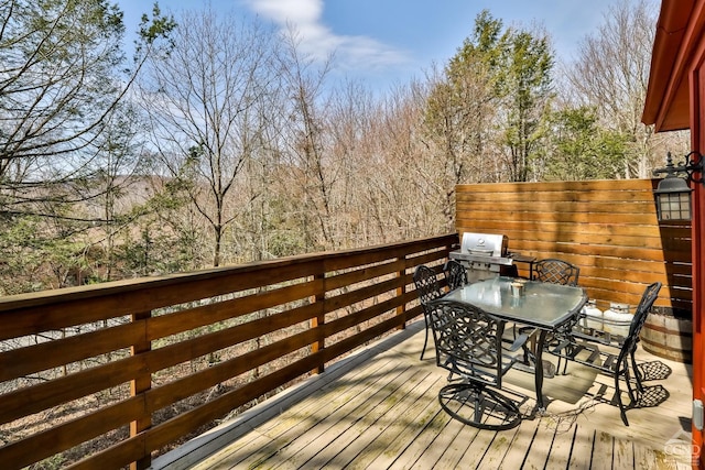 deck with outdoor dining space