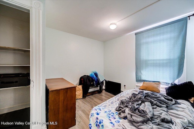 bedroom featuring wood finished floors