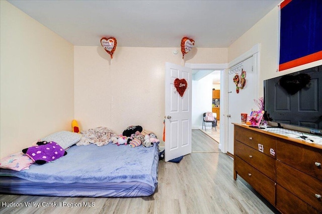 bedroom featuring light wood-style floors