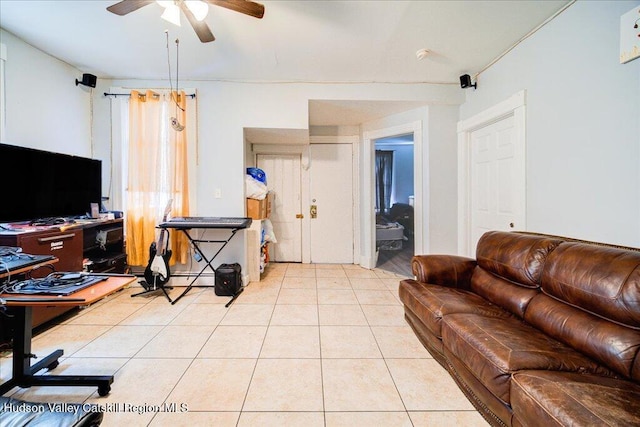 living room featuring light tile patterned floors and ceiling fan