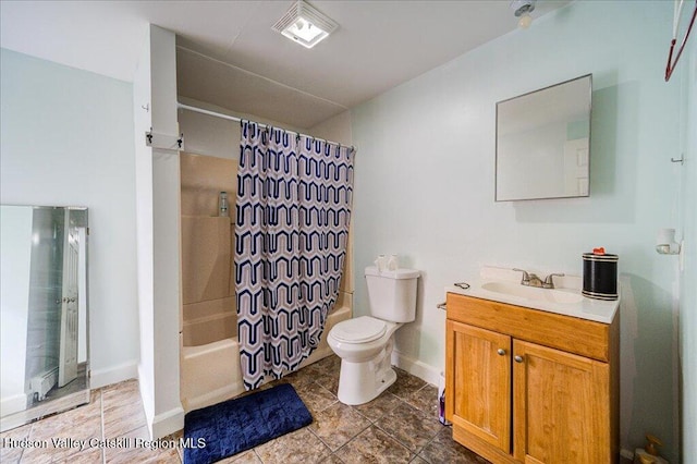 bathroom featuring baseboards, vanity, toilet, and shower / tub combo with curtain