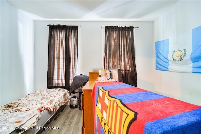 bedroom featuring wood finished floors
