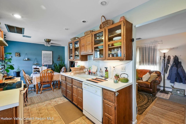 339-345 Jessup Rd, Florida, NY 10921 - kitchen with white appliances, brown cabinetry, glass insert cabinets, light countertops, and ceiling fan