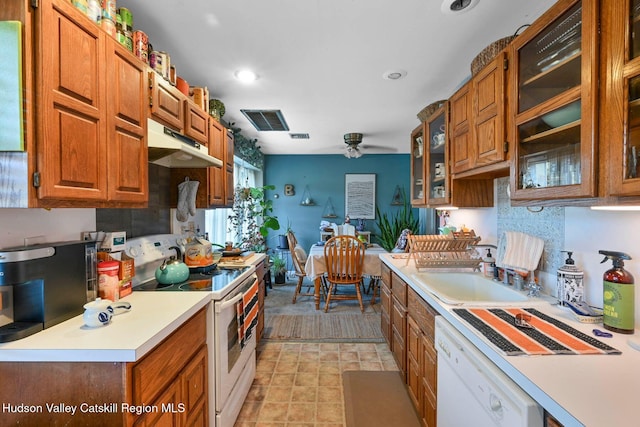 339-345 Jessup Rd, Florida, NY 10921 - kitchen featuring white appliances, under cabinet range hood, brown cabinetry, light countertops, and a ceiling fan
