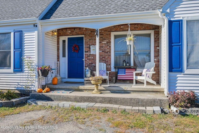 339-345 Jessup Rd, Florida, NY 10921 - entrance to property featuring covered porch, roof with shingles, and brick siding