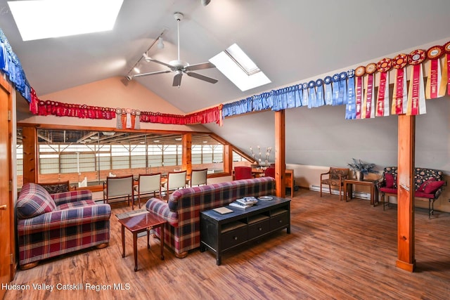 339-345 Jessup Rd, Florida, NY 10921 - living room with a skylight, wood finished floors, a ceiling fan, lofted ceiling, and track lighting
