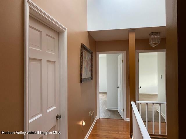 21 Lohmaier Ln, Lake Katrine, NY 12449 - corridor featuring light wood-type flooring and an upstairs landing