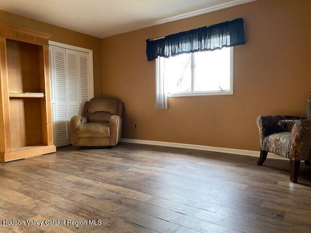 unfurnished room featuring hardwood / wood-style flooring