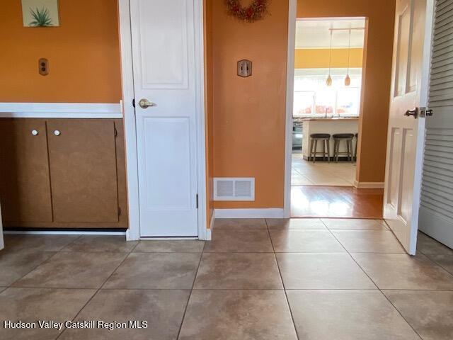 21 Lohmaier Ln, Lake Katrine, NY 12449 - corridor featuring tile patterned flooring and baseboards