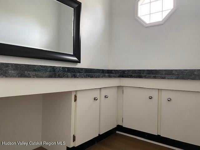 bathroom with wood-type flooring