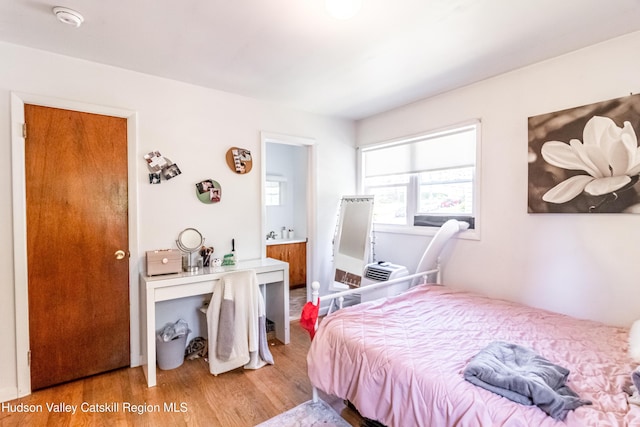 bedroom with wood finished floors