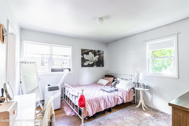 bedroom featuring wood finished floors