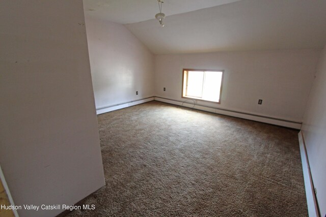 spare room with carpet flooring, a baseboard heating unit, and lofted ceiling