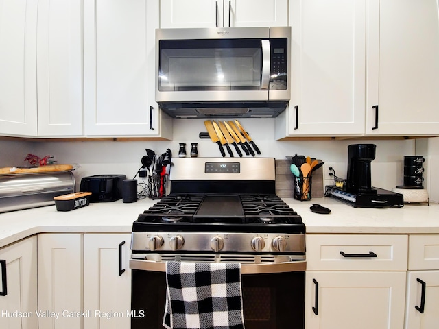 40 Fairview Ave, Hudson, NY 12534 - kitchen with appliances with stainless steel finishes and white cabinetry