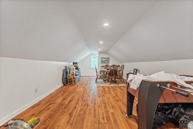  - rec room with lofted ceiling, light wood-style flooring, baseboards, and recessed lighting