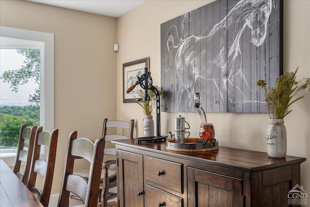  - bar featuring healthy amount of natural light