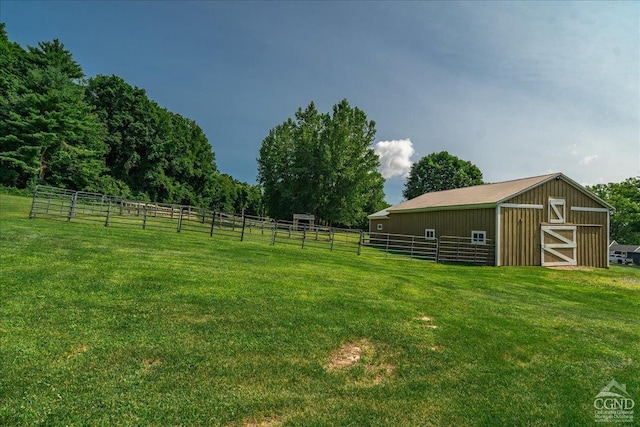  - view of green lawn featuring an exterior structure and an outdoor structure