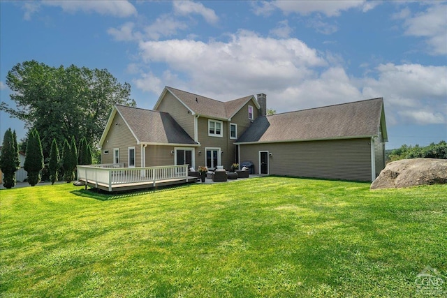  - rear view of property featuring outdoor lounge area, a chimney, a lawn, and a deck