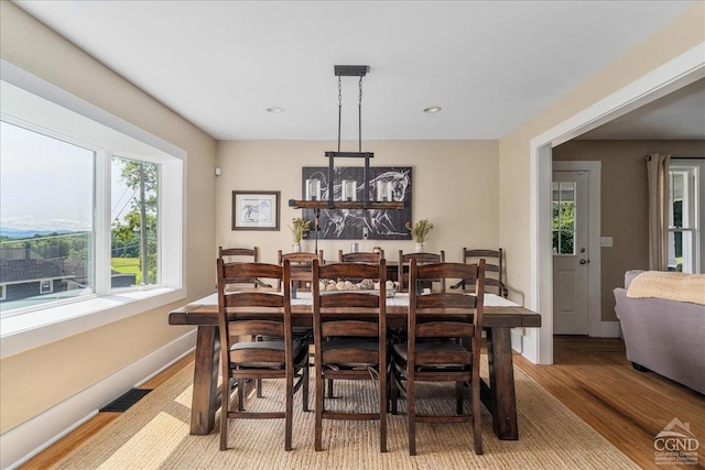  - dining room with light wood-style floors, baseboards, and recessed lighting
