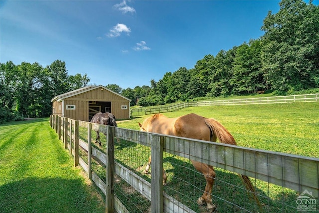  - view of yard featuring an exterior structure, an outbuilding, and a view of countryside