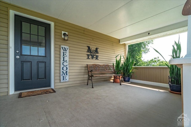  - view of exterior entry featuring a porch
