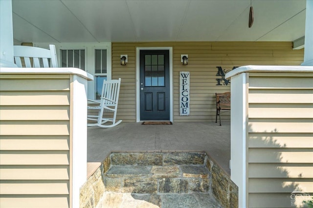  - entrance to property featuring a porch