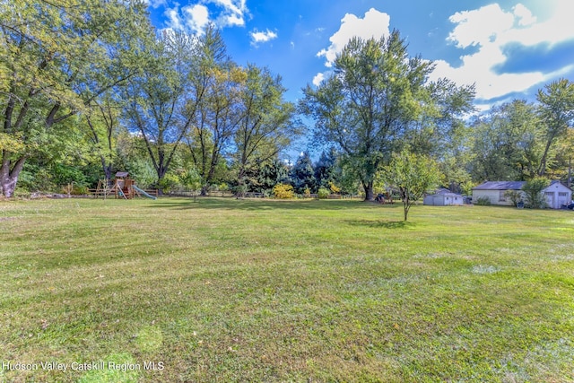 179 Grove St, Tillson, NY 12486 - view of green lawn with a playground and view of scattered trees