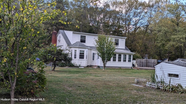 179 Grove St, Tillson, NY 12486 - traditional-style home with a chimney and view of scattered trees