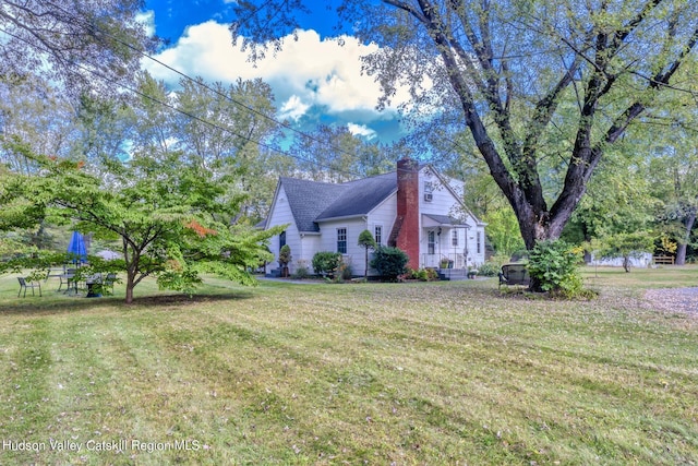 179 Grove St, Tillson, NY 12486 - view of side of property with a chimney and a lawn
