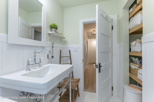 179 Grove St, Tillson, NY 12486 - bathroom featuring a wainscoted wall, a sink, and tile patterned floors