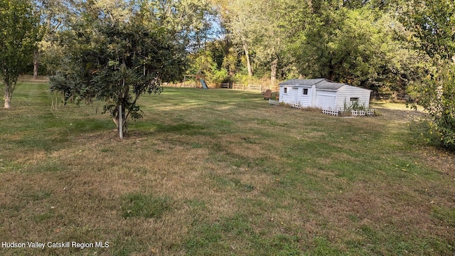 179 Grove St, Tillson, NY 12486 - view of green lawn with an outbuilding
