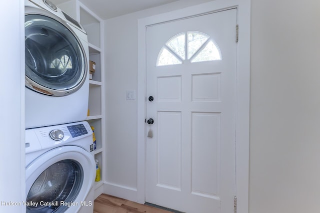 179 Grove St, Tillson, NY 12486 - washroom featuring stacked washing machine and dryer and wood finished floors