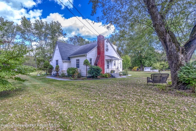 179 Grove St, Tillson, NY 12486 - view of side of home with a chimney, a yard, and roof with shingles