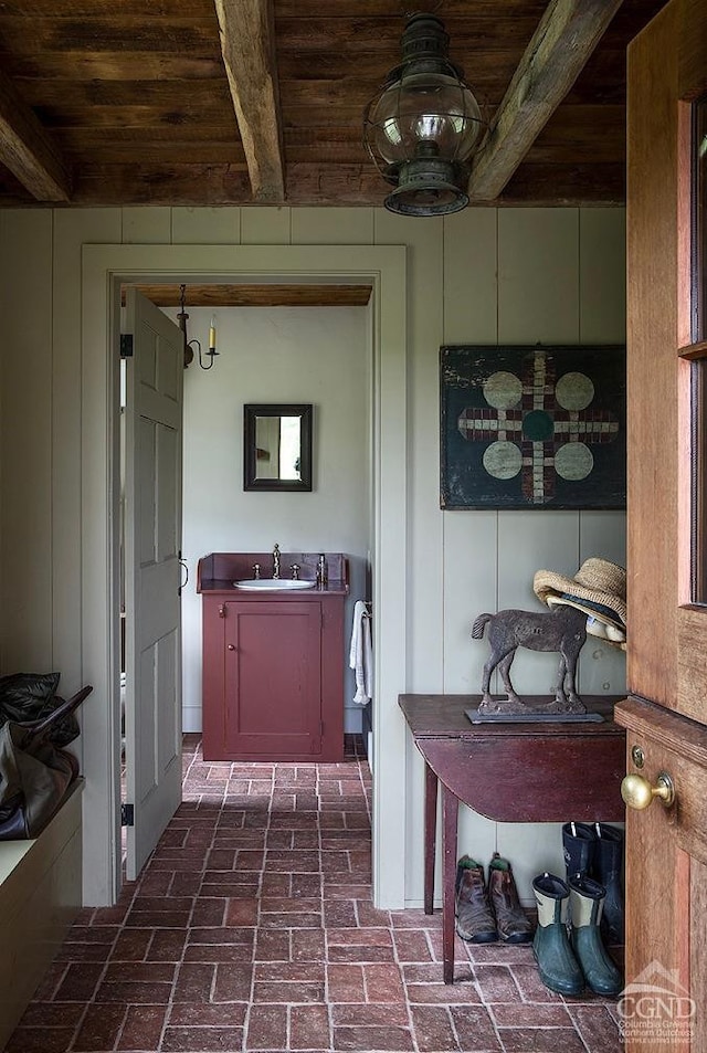118 Finkle Rd, Ancram, NY 12503 - bathroom with wood ceiling, a sink, brick flooring, and beam ceiling