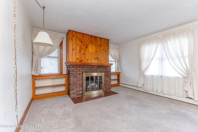 unfurnished living room with a fireplace, light colored carpet, and a baseboard radiator