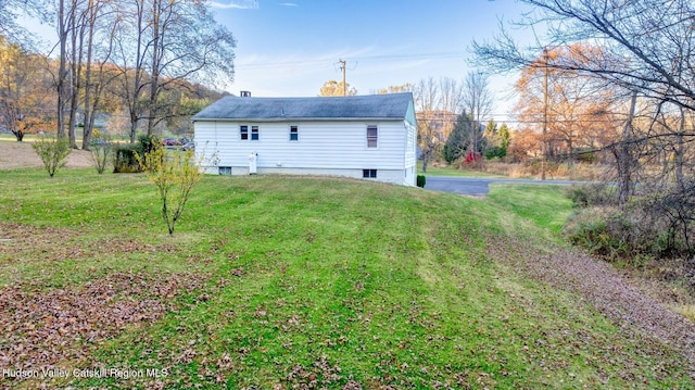 back of house with a yard