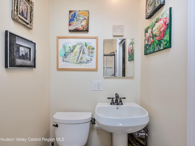 bathroom with toilet and sink