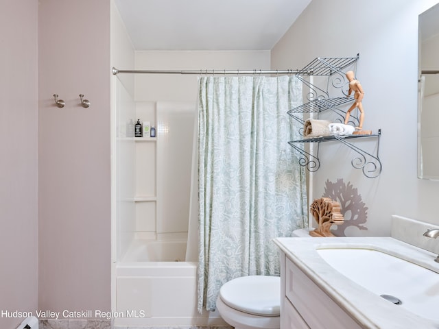 full bathroom with vanity, toilet, and shower / bath combo with shower curtain