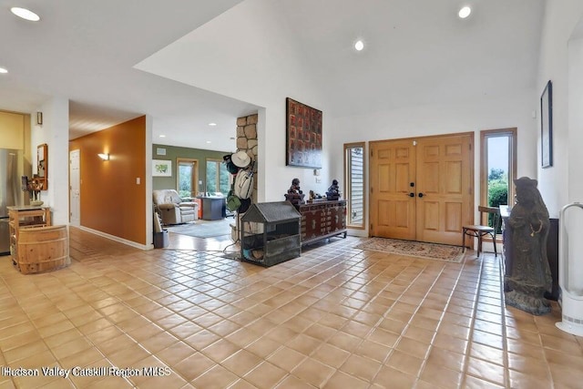 tiled entryway with a wealth of natural light