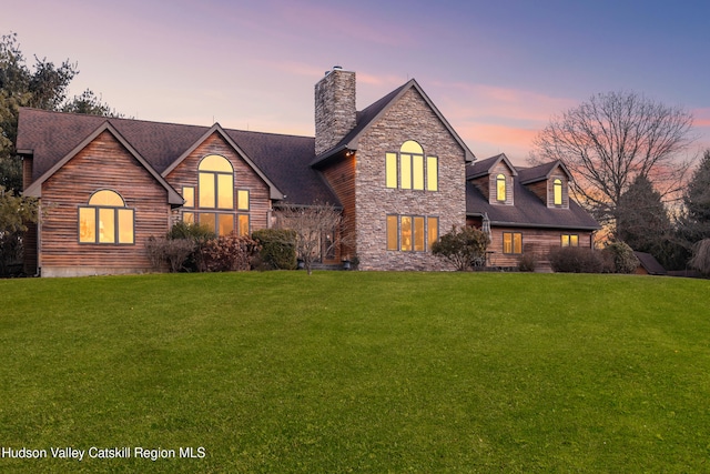 view of front of home with a lawn